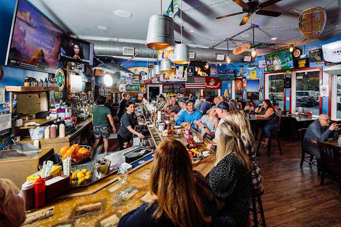Shuckin' Shack Bar, Surf City, NC a packed bar with televisions and local decor in surf city nc
